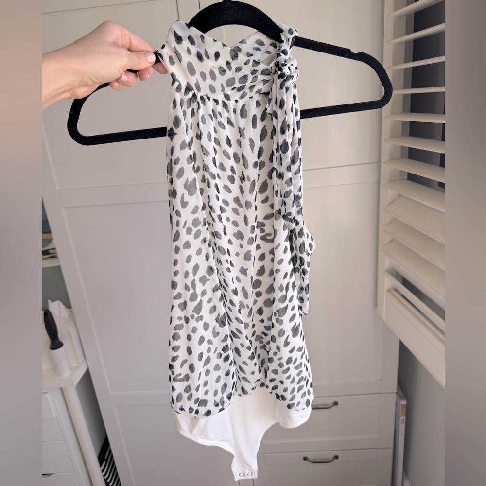 Express sleeveless bowtie around neck bodysuit. Like new. Size medium